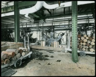 Paper Making: Several Wood Grinding Machines; Blocks of Pulp Wood. International Paper Co., Fort Edward N.Y.