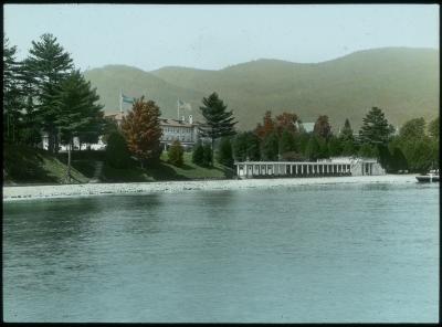 Fort William Henry Hotel and Grounds from the Lake, Mountains in Background