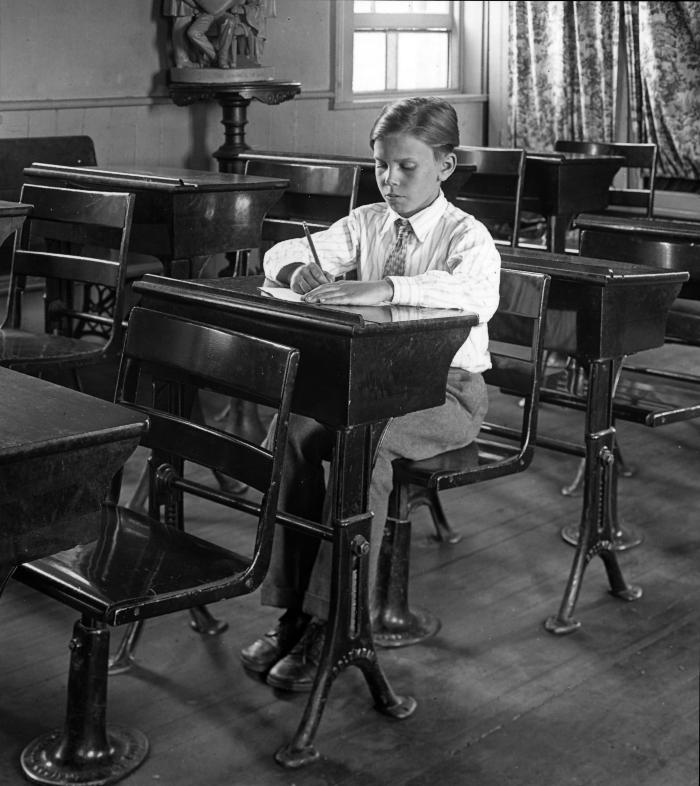 Education.  Boy Sitting at Desk