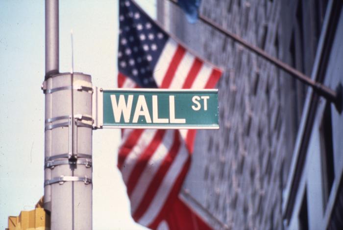 Wall Street sign, with flag