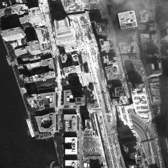 [Aerial photograph, flying northwest along west side of lower Manhattan, 09/15/2001]