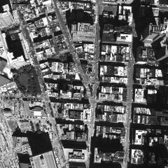 [Aerial photograph, flying northwest along west side of lower Manhattan, 09/15/2001]