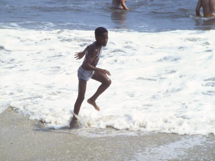 Long Island, boy playing on the beach