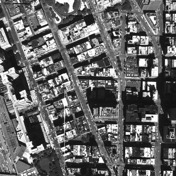 [Aerial photograph, flying northwest along west side of lower Manhattan, 09/15/2001]