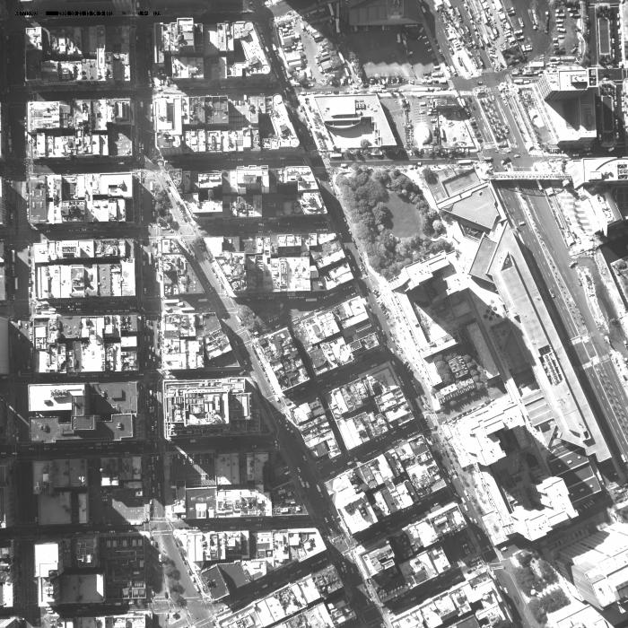 [Aerial photograph, flying southeast along west side of lower Manhattan, 10/21/2001]