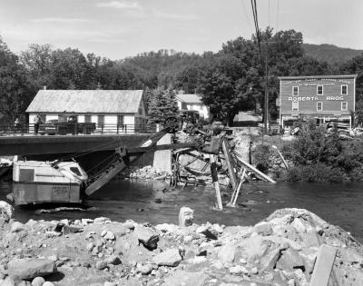 Crane operating under a bridge, Jay, NY