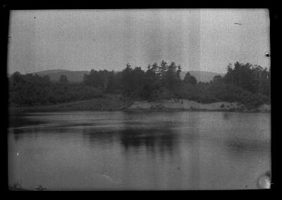 New York State lake surrounded by pine trees