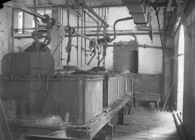 Interior of factory room with large vats