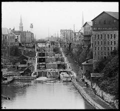 Two tiers of five locks, old Erie Canal; tow path on right. Lockport, N.Y.