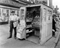 John Pietraszak, Broadway and Fillmore Streets, Buffalo, NY.Photo of blind newspaper vendor outside his newspaper stand.