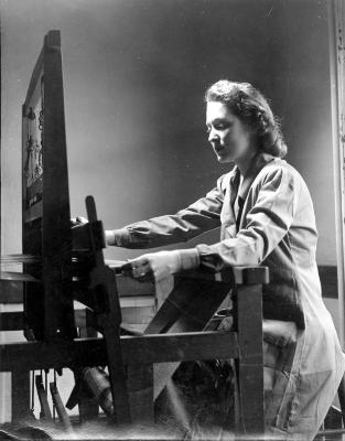 Paul Parker Studio, NYC. Unidentified photo of woman sitting at loom.