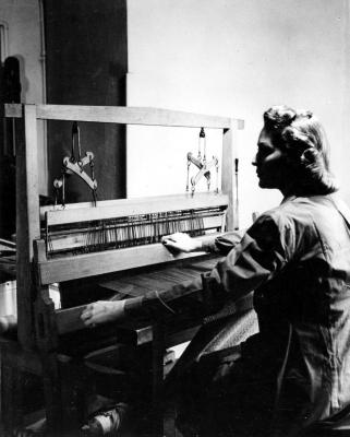 Paul Parker Studio, NYC. Unidentified photo of woman sitting at loom (close-up).