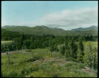 Panorama West over Elizabethtown (Essex Co.), Pitchoff Pass (right distance); Forest Covered Mountains