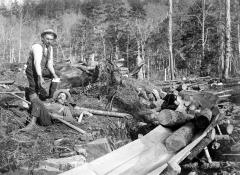 Loggers. Unidentified print of two men near a timber conveyor structure