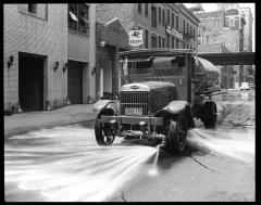 New York City. Flushing Street with modern motor sprinkler