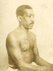 Inmate from Clinton Prison showing tattoos, No. 19