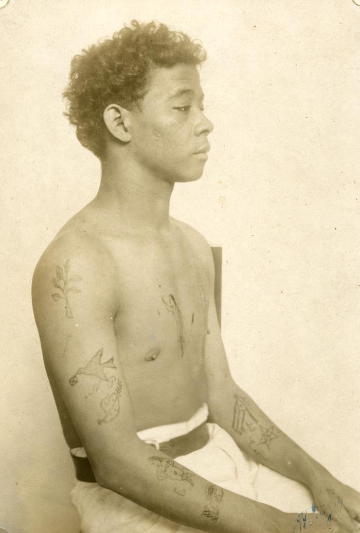 Inmate from Clinton Prison showing tattoos, No. 12