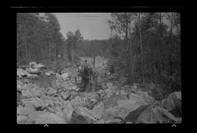 Breaking rocks with jackhammer for truck trail, Franklin County