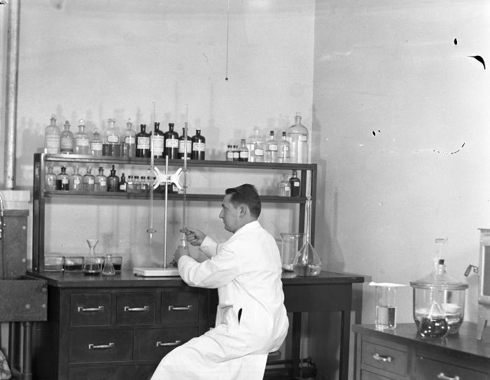 Scientist at a work station at the Bayville Bridge experimental shellfish hatchery