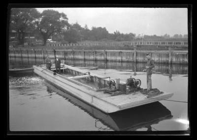 Boat in the oyster pens at the Glen Cove experimental sea farm in Nassau County