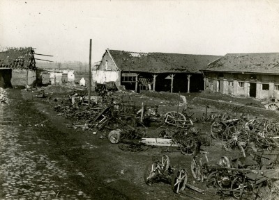 Courtyard of the sugar refinery at Lebaudy[?], with destroyed agricultural machinery, in Roye (Somme), France