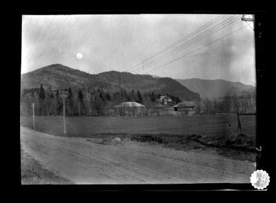 Houses by a dirt road in the village of Lake Placid