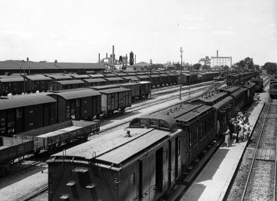 Railway Yards, Passenger and Freight Trains; Factories in Distance. Saloniki, Greece