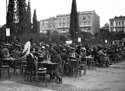 Section of Constitution Square on Summer Evening Filled with People Drinking at Tables. Athens, Greece