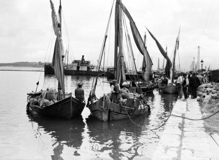 Lighters in Harbor, Unloading American Wheat. Corfu, Island of Corfu, Greece