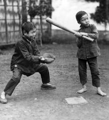 Two Chinese orphans playing baseball, China