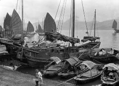 Sampans and junks along waterfront, Hong Kong