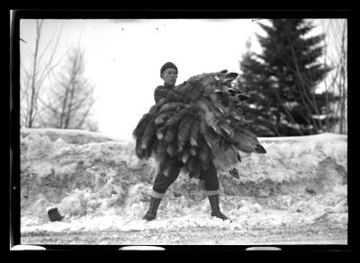 Man holding fox pelts