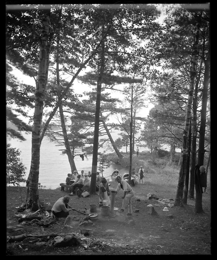 Picnic party preparing dinner on camp stove (provided by the State), Watterson's Point, St. Lawrence Reservation