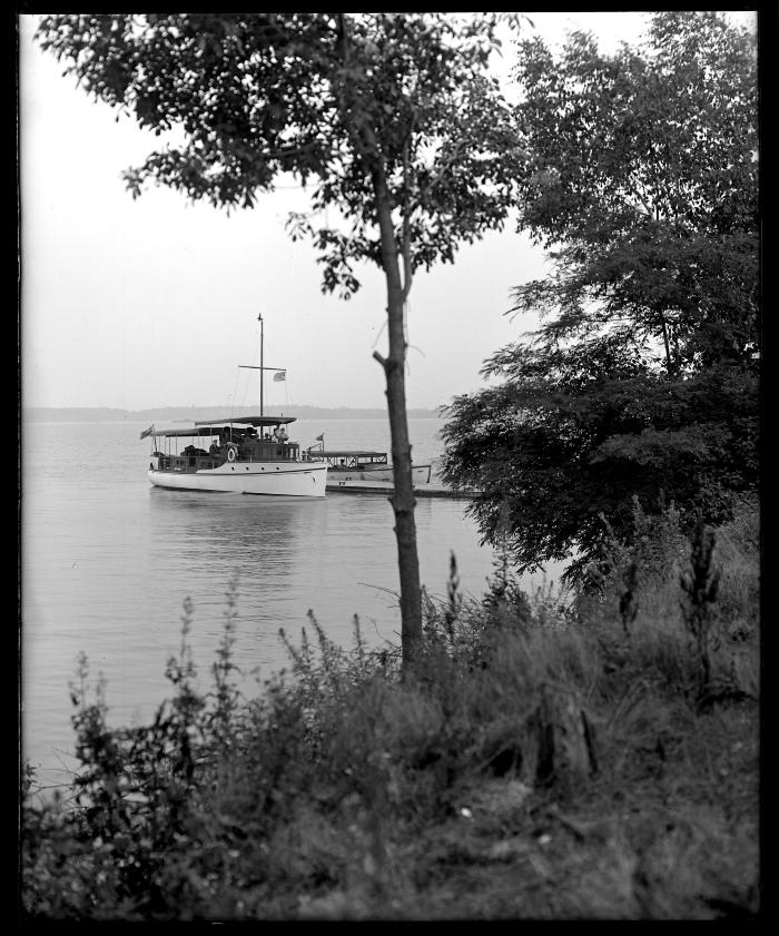 Canadian yacht and State boat "Merry Widow, 2nd" at pier, Canoe Point, St. Lawrence Reservation