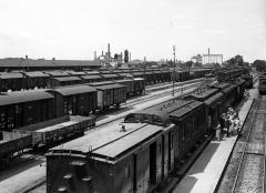 Railway Yards, Passenger and Freight Trains; Factories in Distance. Saloniki, Greece