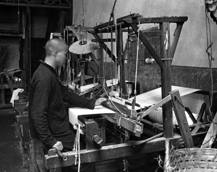 Man operating a cotton loom, Kowloon, China