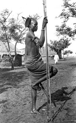 Sudan - Shilluk Warrior Resting; Huts