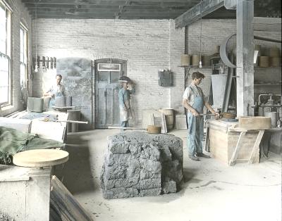 Three men making pottery from clay. Sagger Making at Iroquois China Company