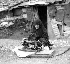 Turkey. Haidar Pasha. Turkish Woman Using Sewing Machine in Front of Hut